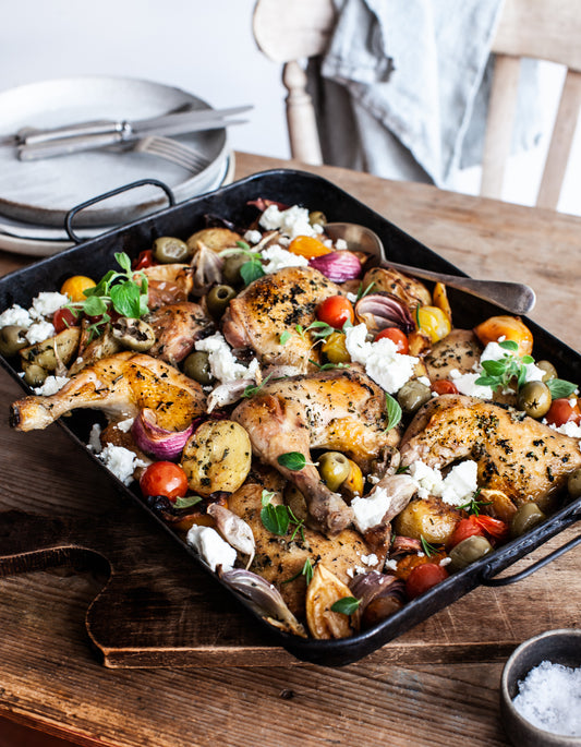 Roast chicken thighs and potatoes with tomatoes, olives and feta